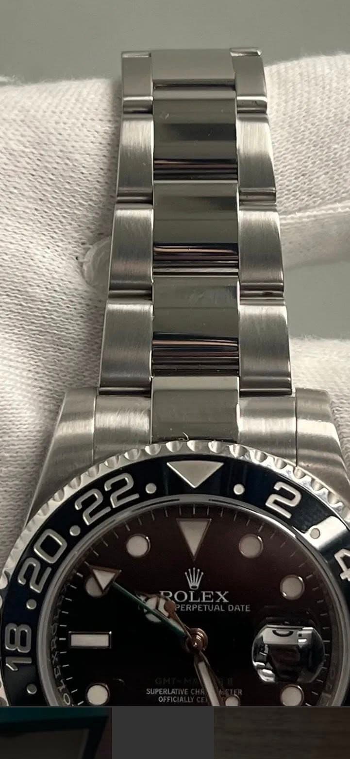May be an image of wrist watch and text