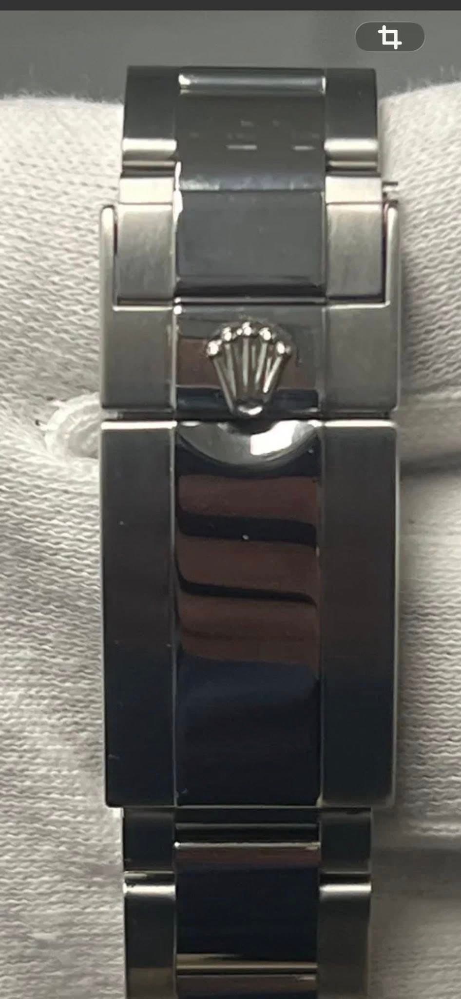 May be an image of wrist watch and text
