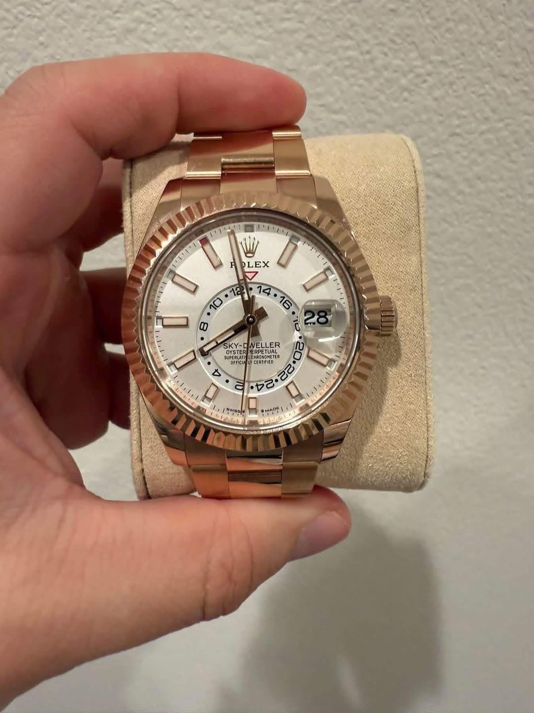 May be an image of wrist watch and text