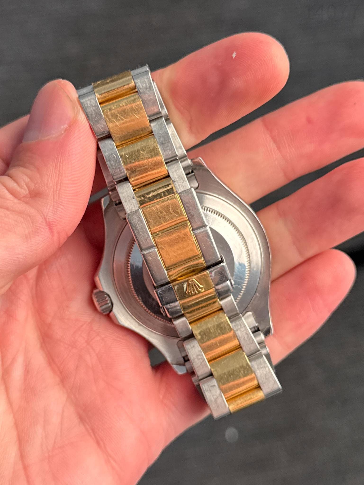 May be an image of wrist watch and text
