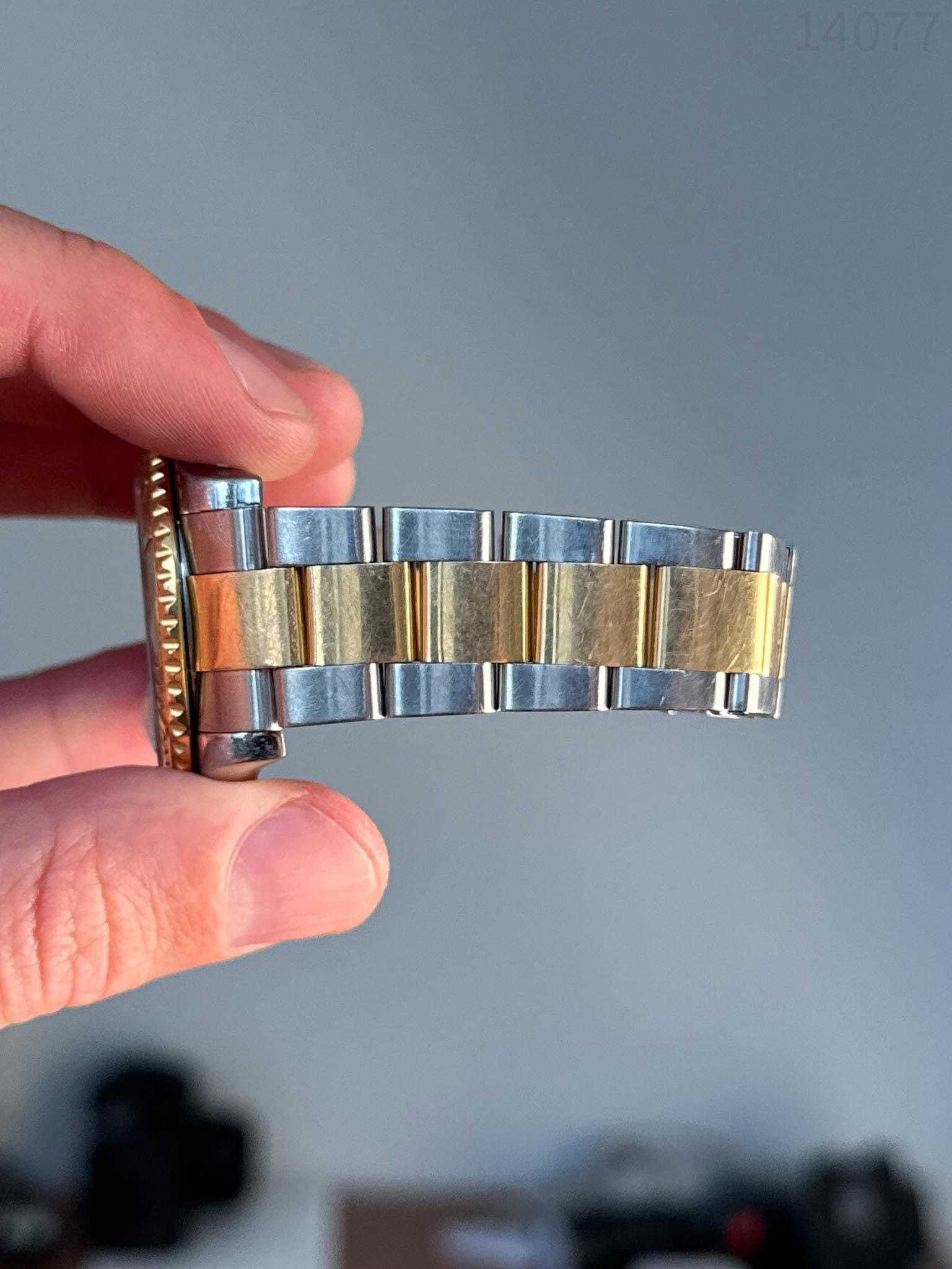 May be an image of wrist watch and text