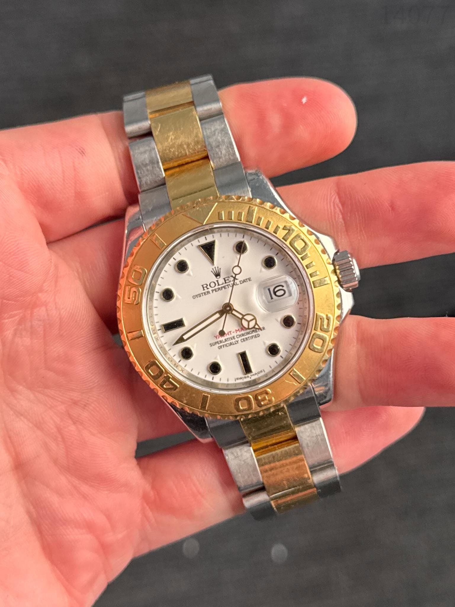 May be an image of wrist watch and text