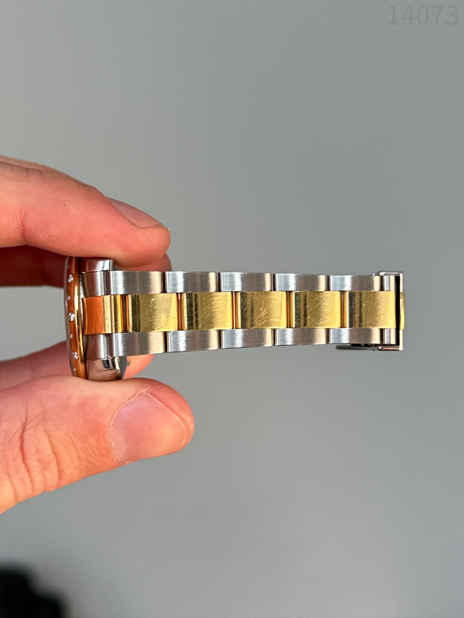 May be an image of wrist watch and text