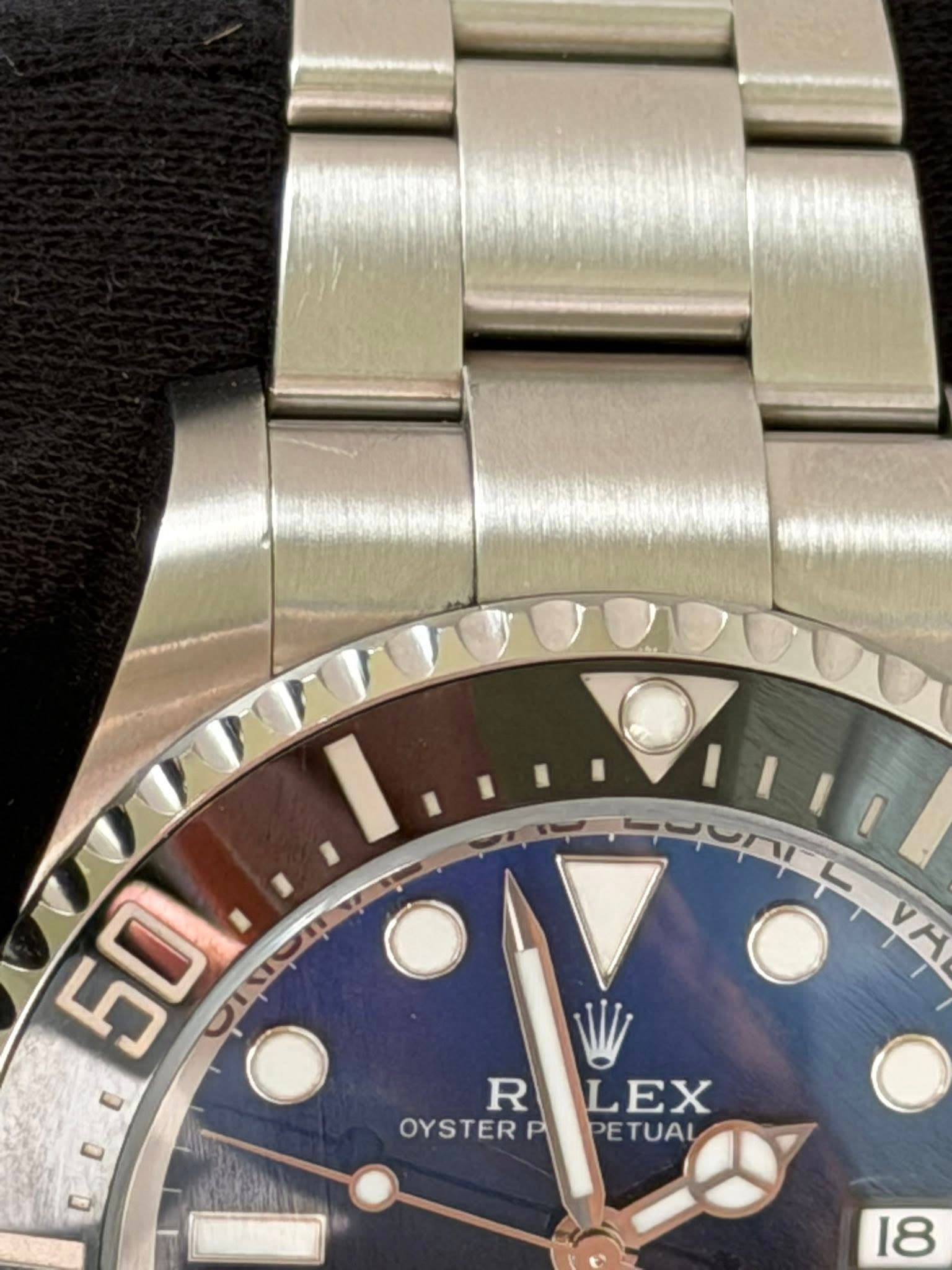 May be an image of wrist watch and text