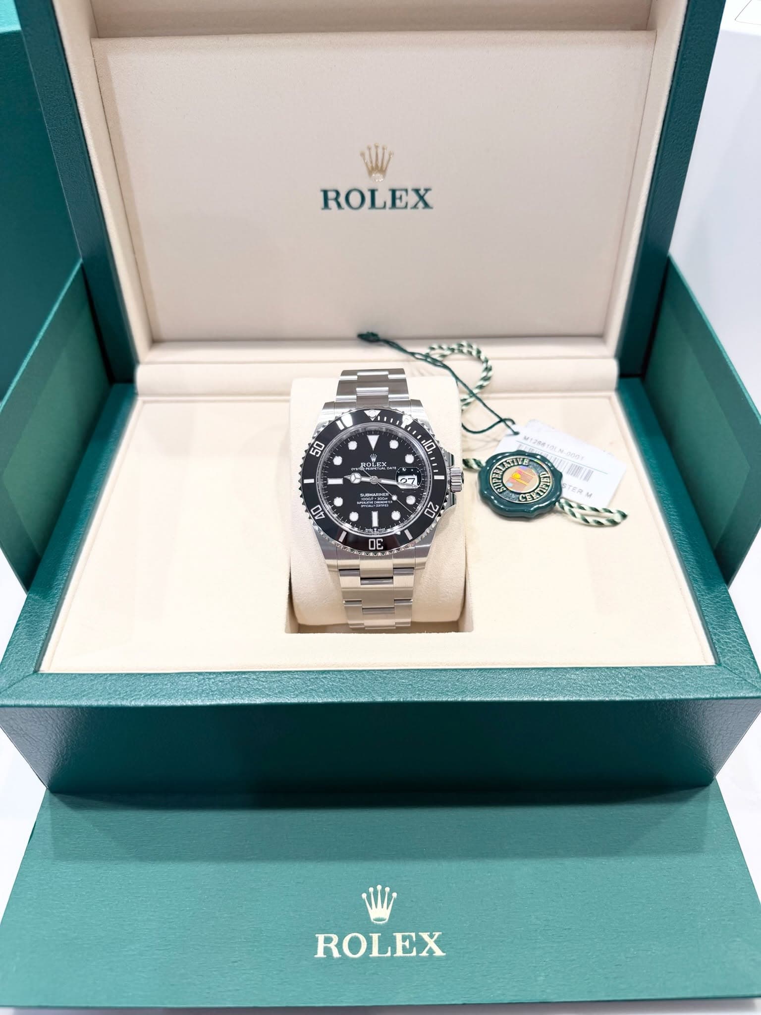 May be an image of wrist watch and text that says 'ROLEX 50 HOLEY 0. 27 D 02 ATE 0 ROLEX'