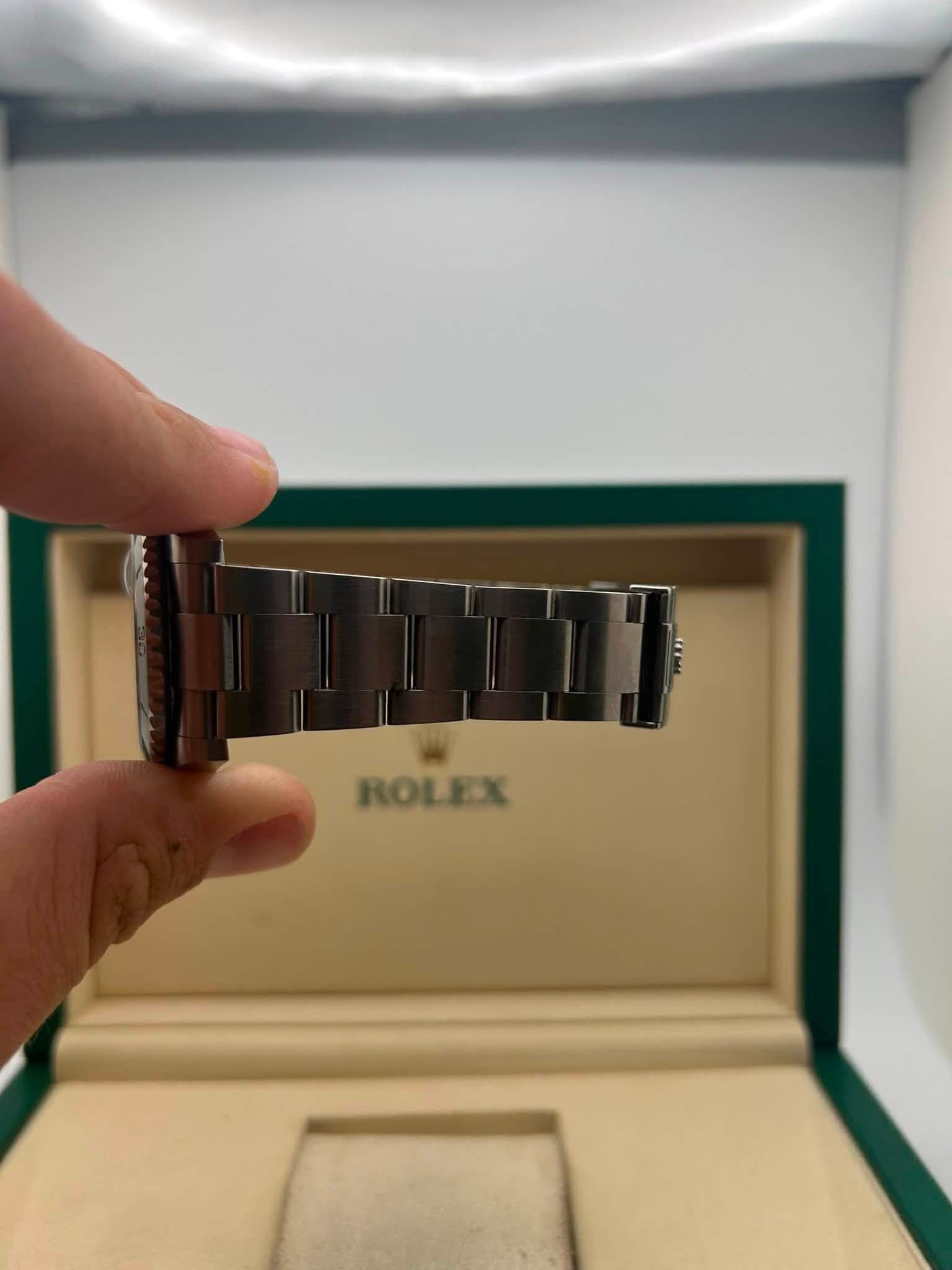 May be an image of wrist watch and text that says 'ROLEX'