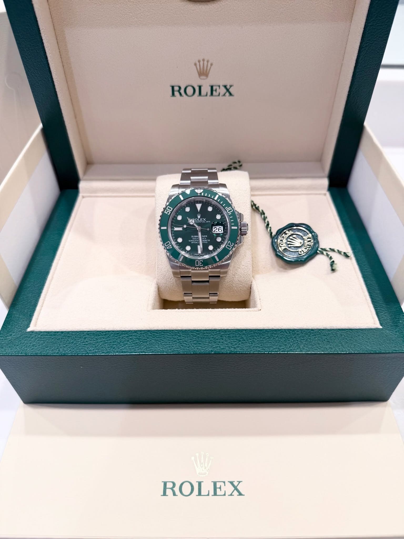 May be an image of wrist watch and text that says 'ROLEX 50 10 TAN LEX. ばい 26 S - ROLEX'