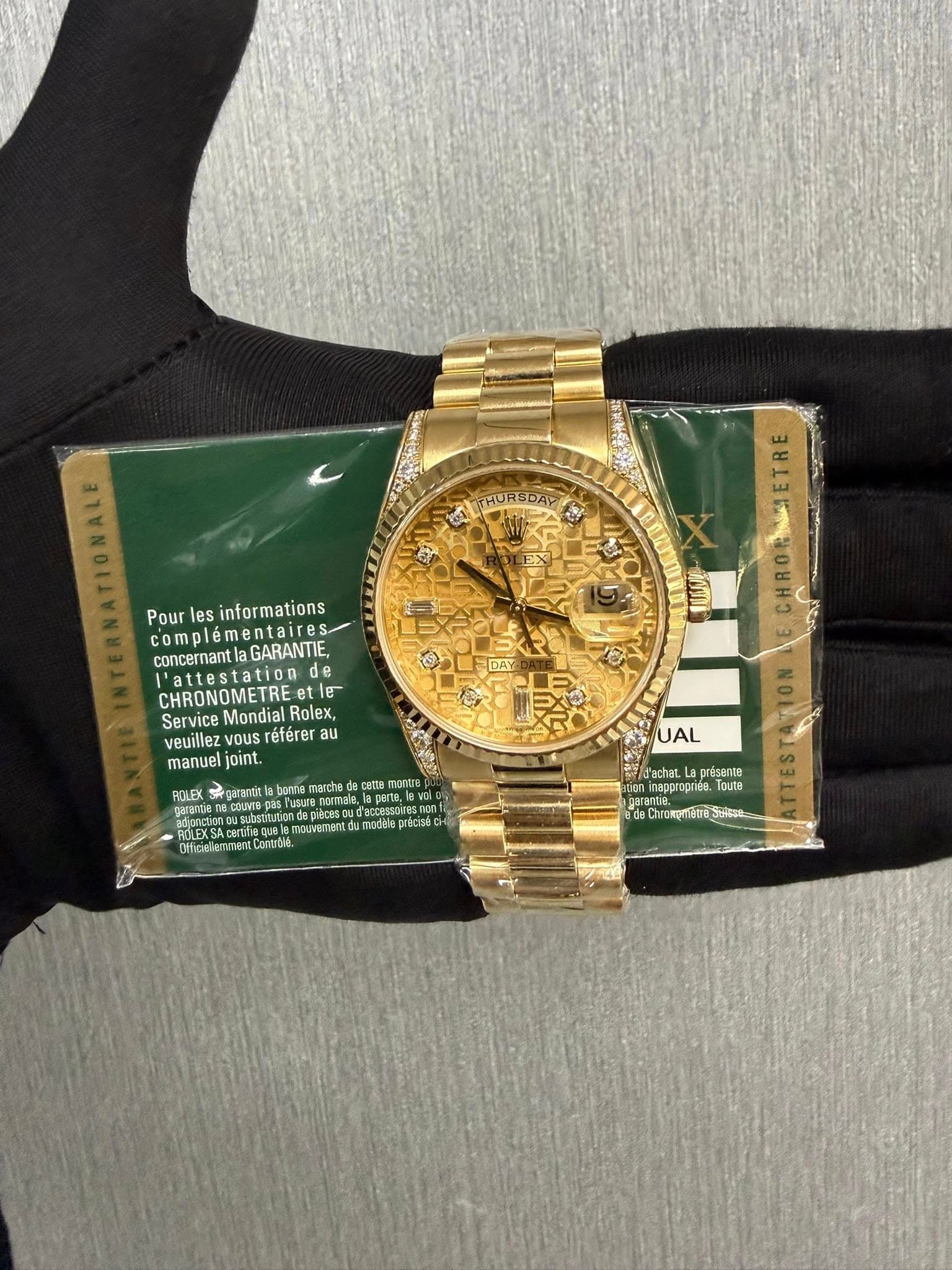 May be an image of wrist watch and text