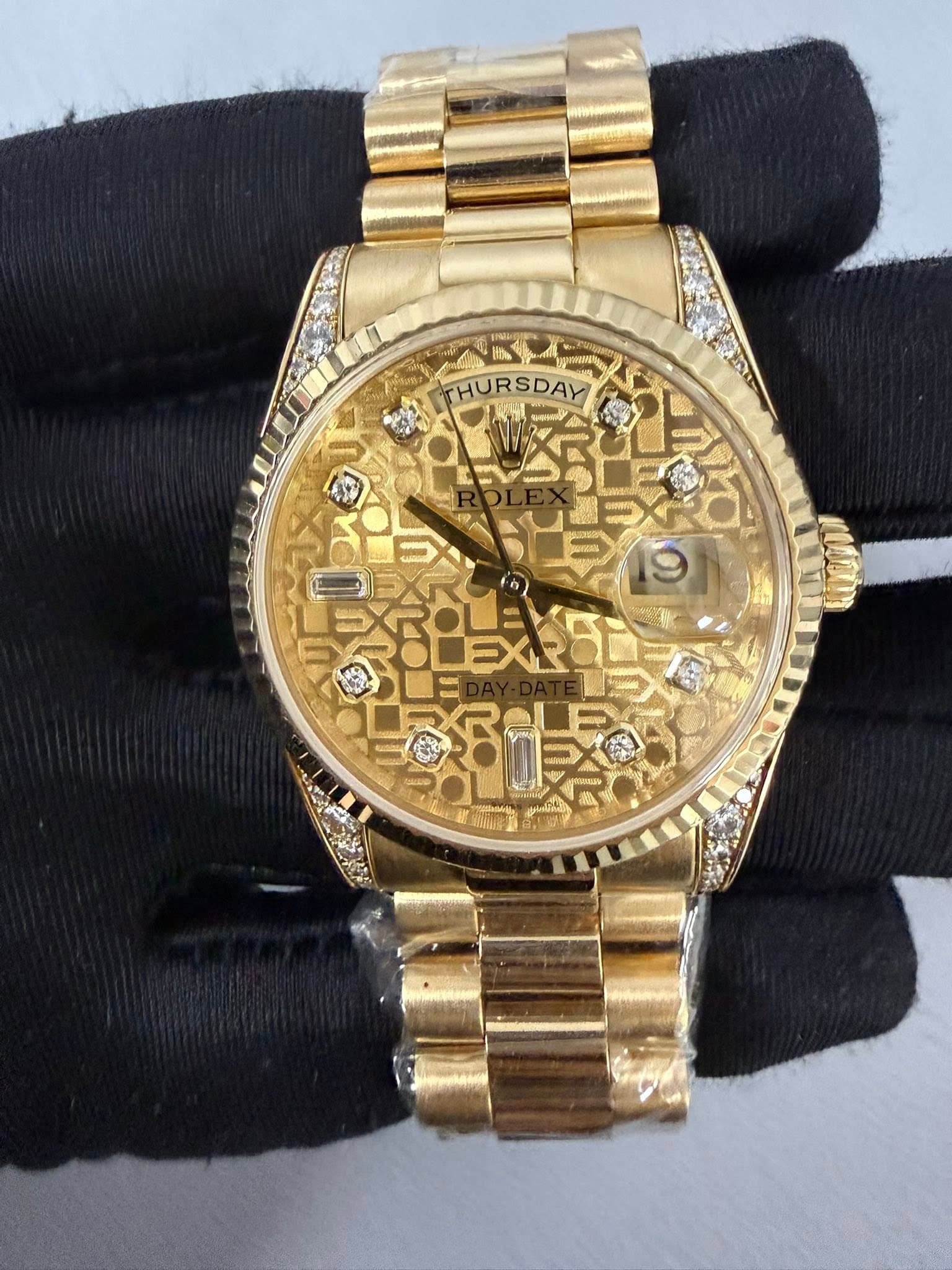 May be an image of wrist watch and text