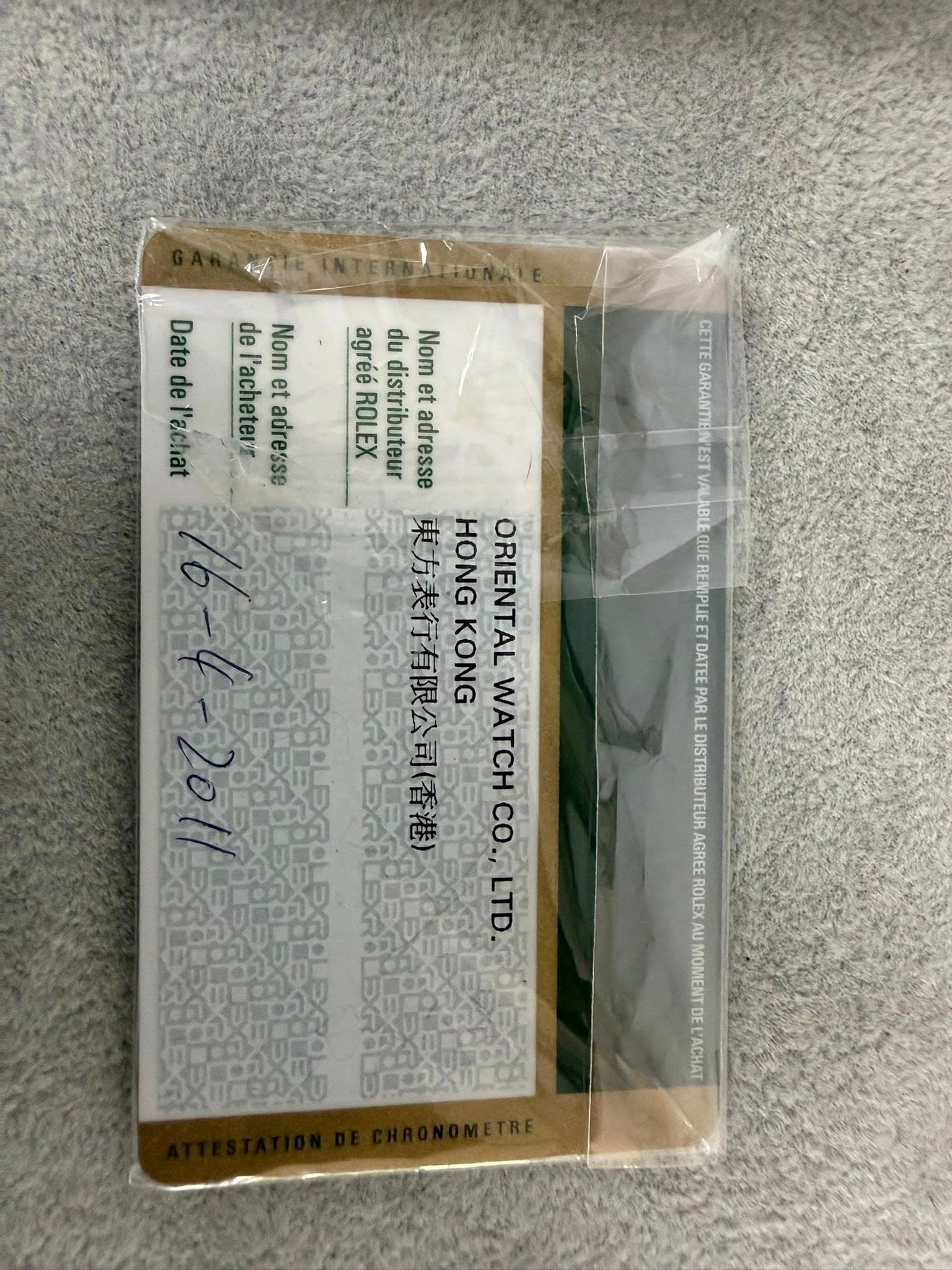 May be an image of ticket stub, matchbook and text that says '311EE GARANTIE Tapa Natedel'acha Date l'acheter de Nometadresse et Nom agréé du Nom de l'achat adresse ROLEX…