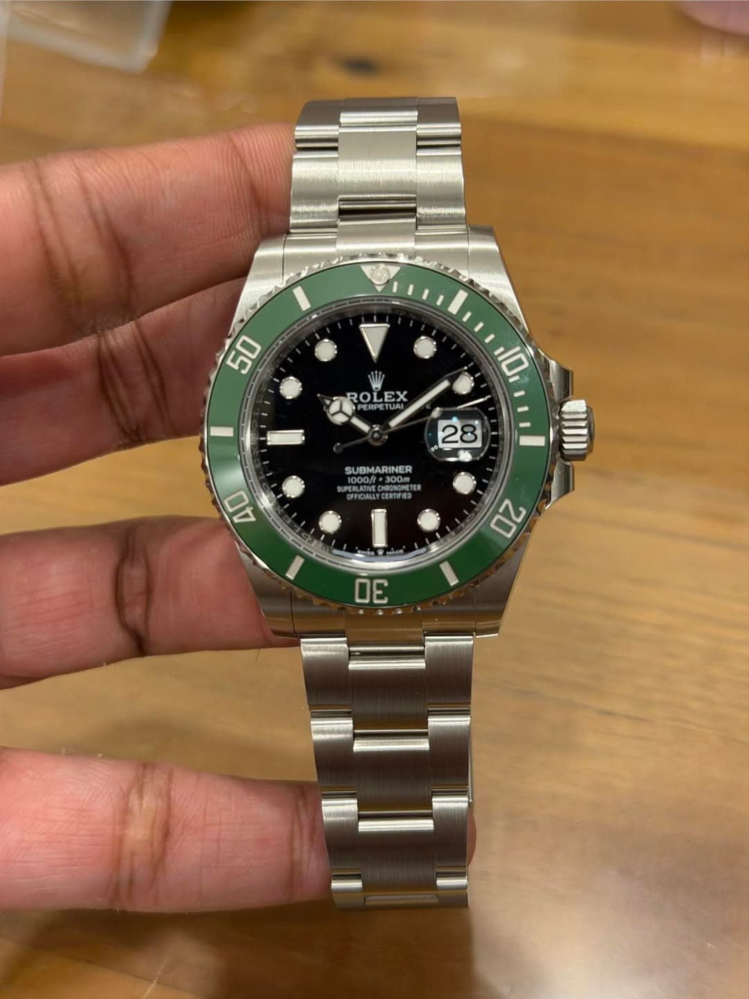 May be an image of wrist watch and text that says '50 50 ROLEX ROL EX 10 28 SUBMARINER 1000f=30 1300m MFCALLE 40 20 30'