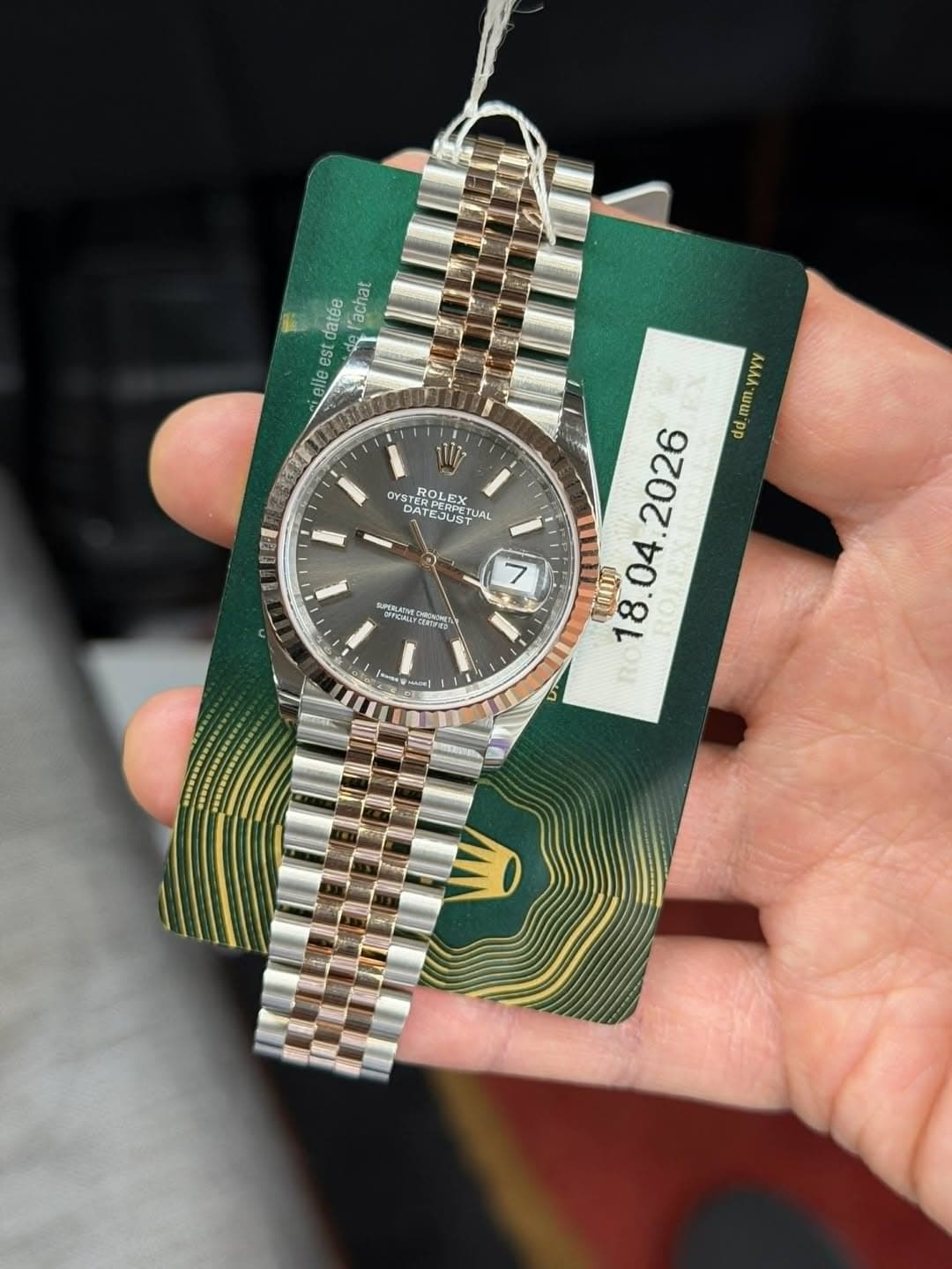 May be an image of wrist watch and text