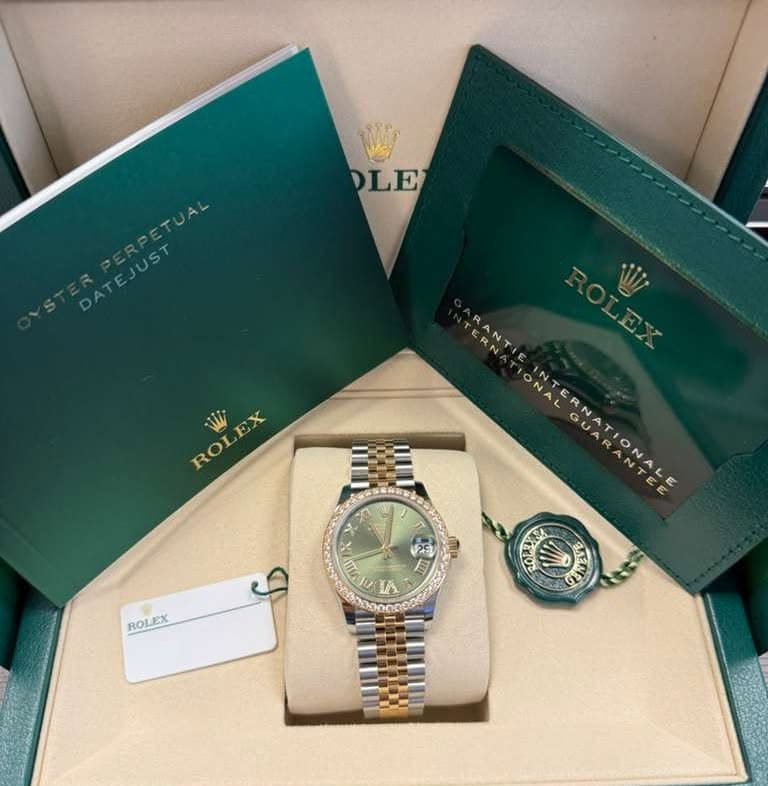 May be an image of wrist watch and text that says 'OLE EX ROL ERN RANTI ONA INTERNATIONALE GU GO 小 SENE 25 目 目 ROLEX ROL তা IA 00nDeA'