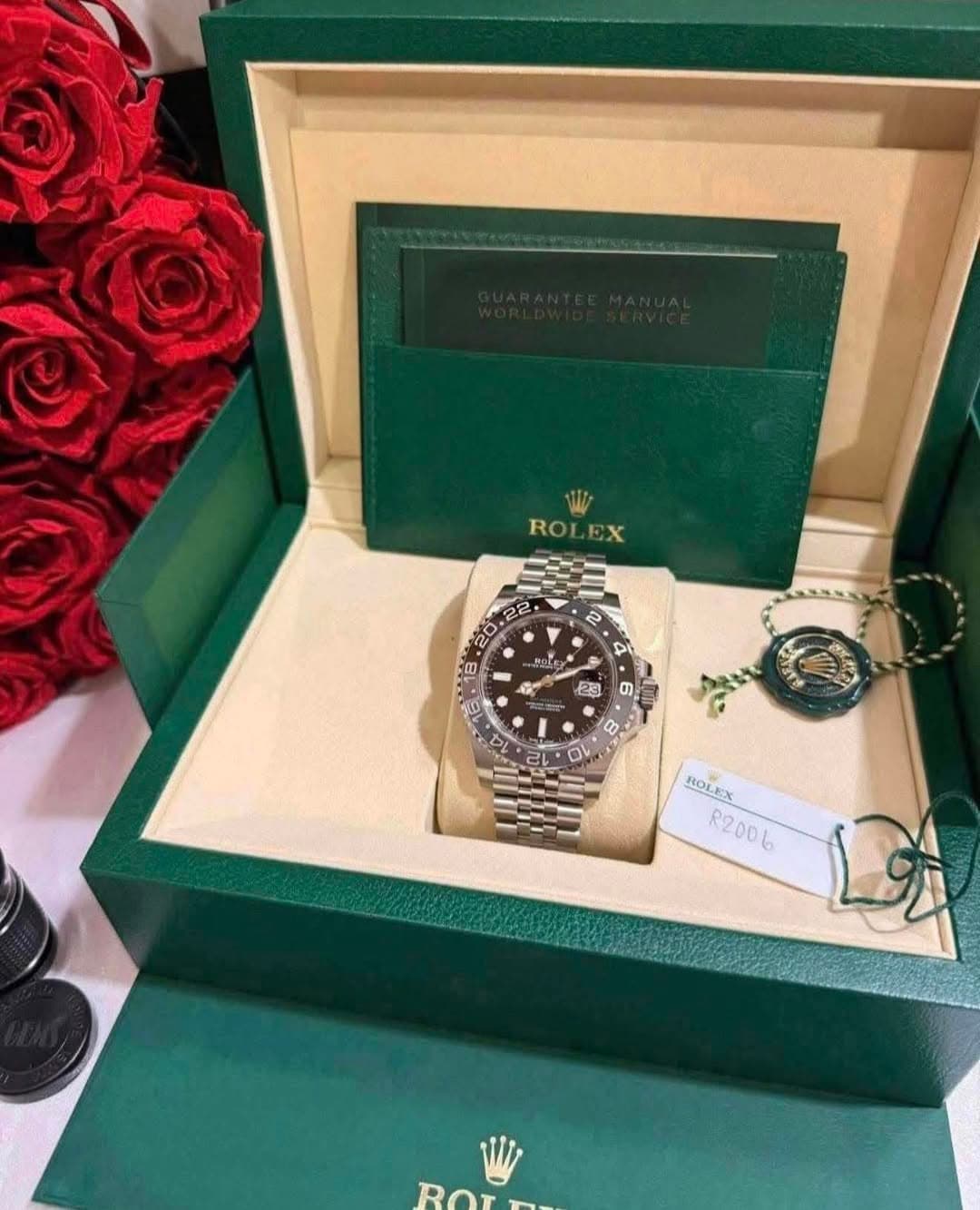 May be an image of wrist watch and text that says 'ROLEX EX ROL ه HOC DC מי 8 6 M 23 0 0 0 0V 10 ROLEX R2006 انا ROr Rorn T-'