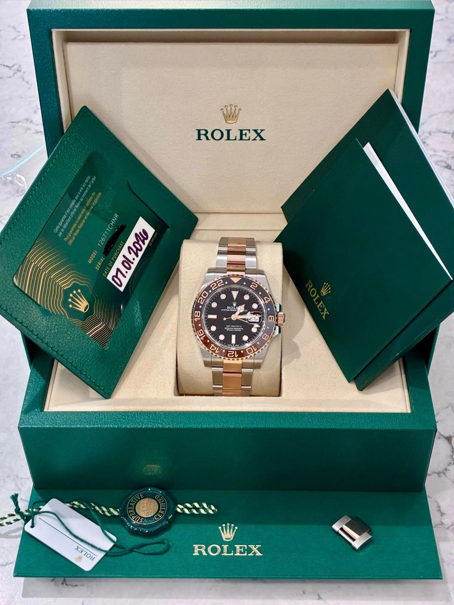 May be an image of wrist watch and text that says 'ROLEX 126711CHNR M7.0l.2024 20W 2 • BOK 18 16 レ UC 12 D 6 SS TN 4 8 TU お x3ToH 10ษ ROLEX'