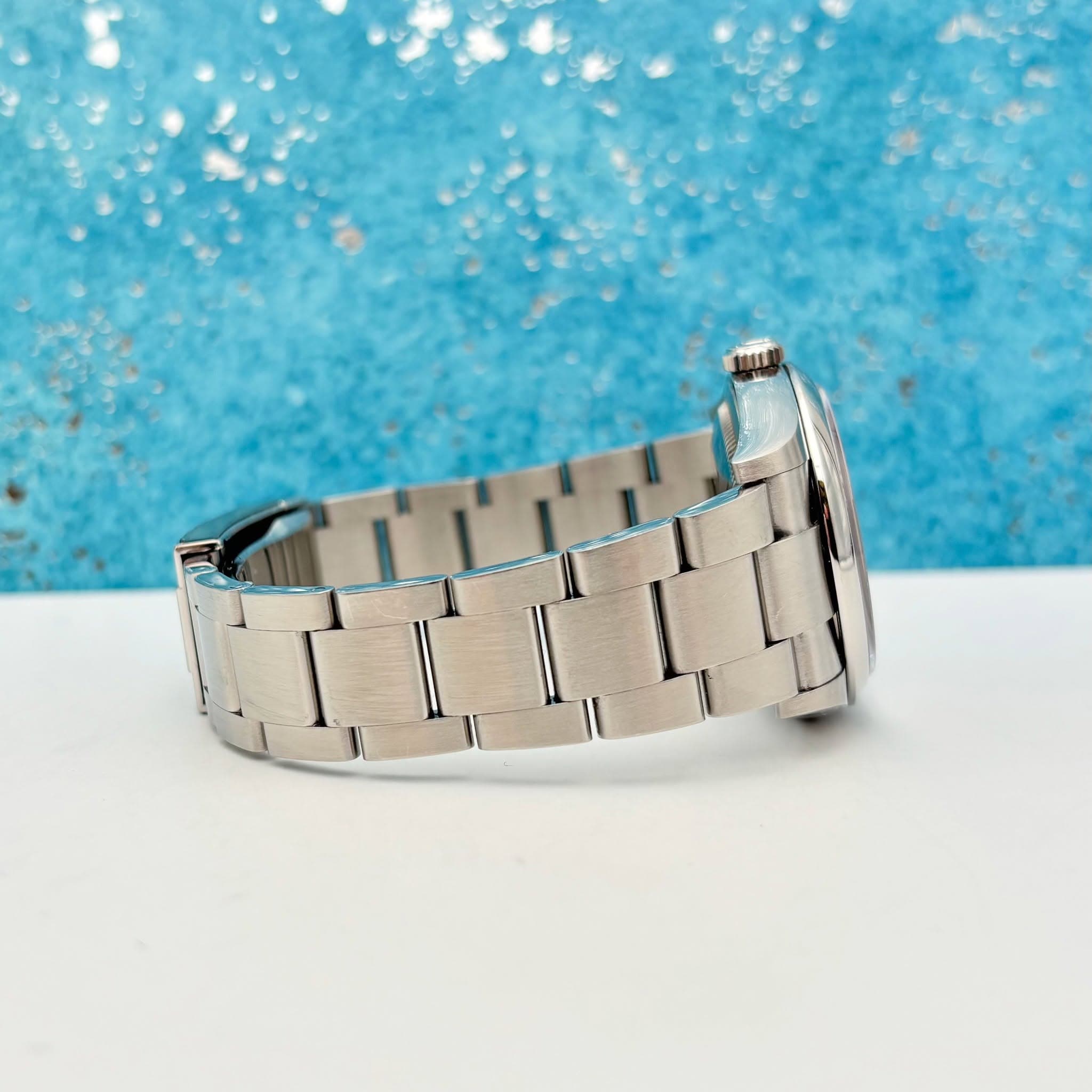 May be an image of wrist watch and jewelry