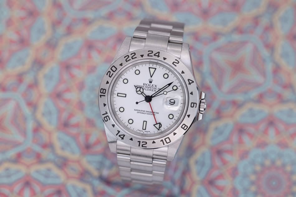 May be an image of wrist watch and text that says ' o o 2 O I GUETE TERFLEX PERPETUAL PLOPETUAL ER ن ROLEX LORER 18 4 9 TER 96 SUPERLATIVE OFFICALEY ONIRIEN OVICIALE CERTI O 1L…