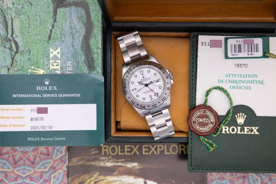 May be an image of wrist watch and text that says 'Y11 F ခ7 TER EP A o ROLEX INTERNATIONAL SERVICE GUARANTEE Serial number 6 16570 Y11 o O HOLEX HOLEX o e 0 o o O0 o Model number:…