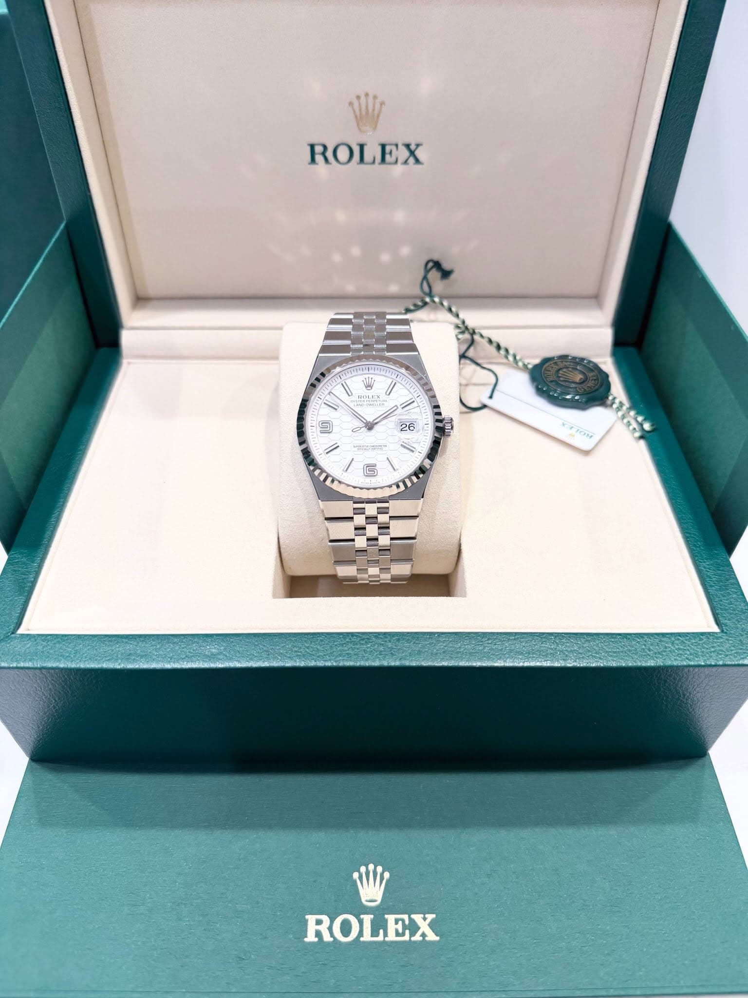 May be an image of wrist watch and text
