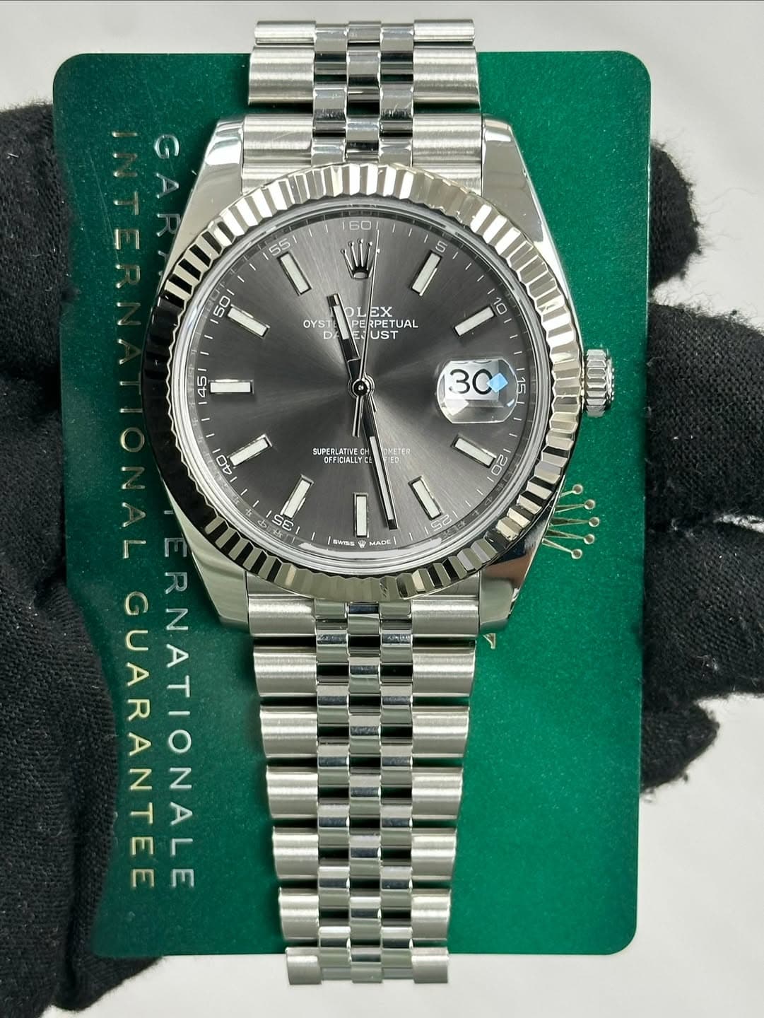 May be an image of wrist watch and text that says ' EX OYSIERUSTUAL E UST OYS1 PETU ETUAL 10 45 3C 15 40 ONETER PHETCR FICIALLYC UPERLATIVECH FItIA I MADE 20 Se CE trWTsE R…