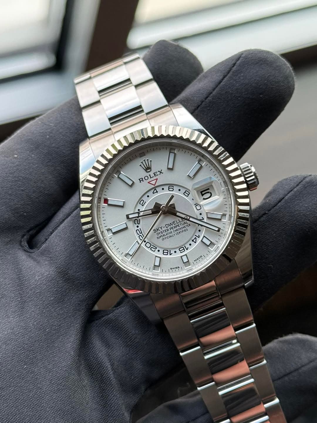 May be an image of wrist watch and text