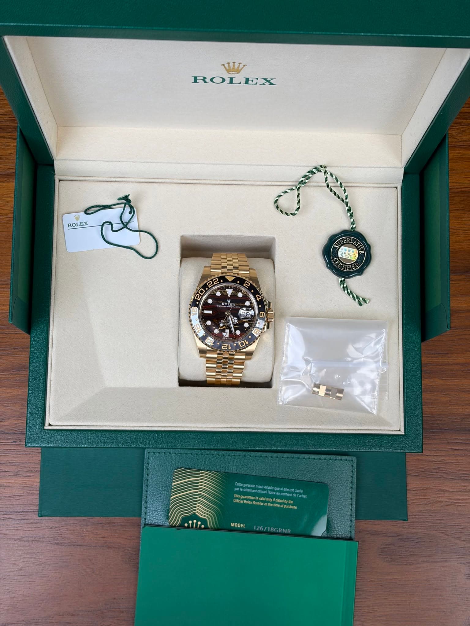 May be an image of wrist watch and text