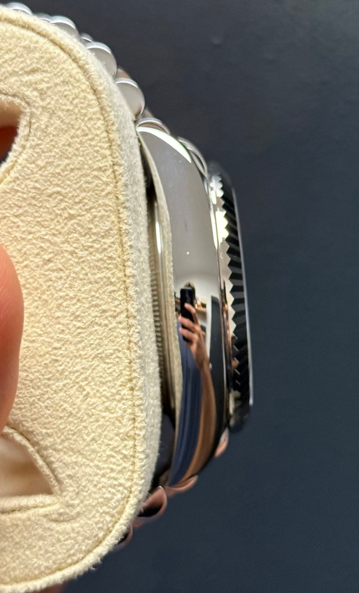May be an image of saddle-stitched leather, leather and wrist watch