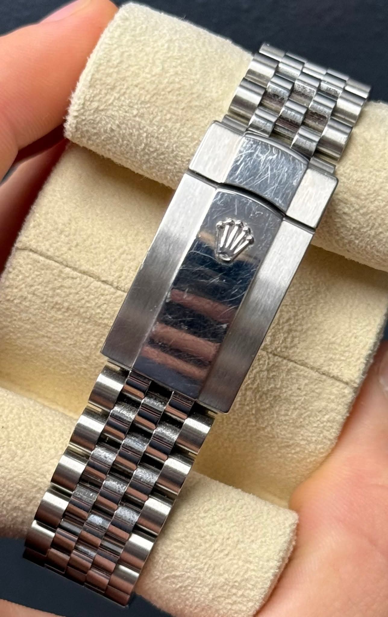 May be an image of wrist watch and text