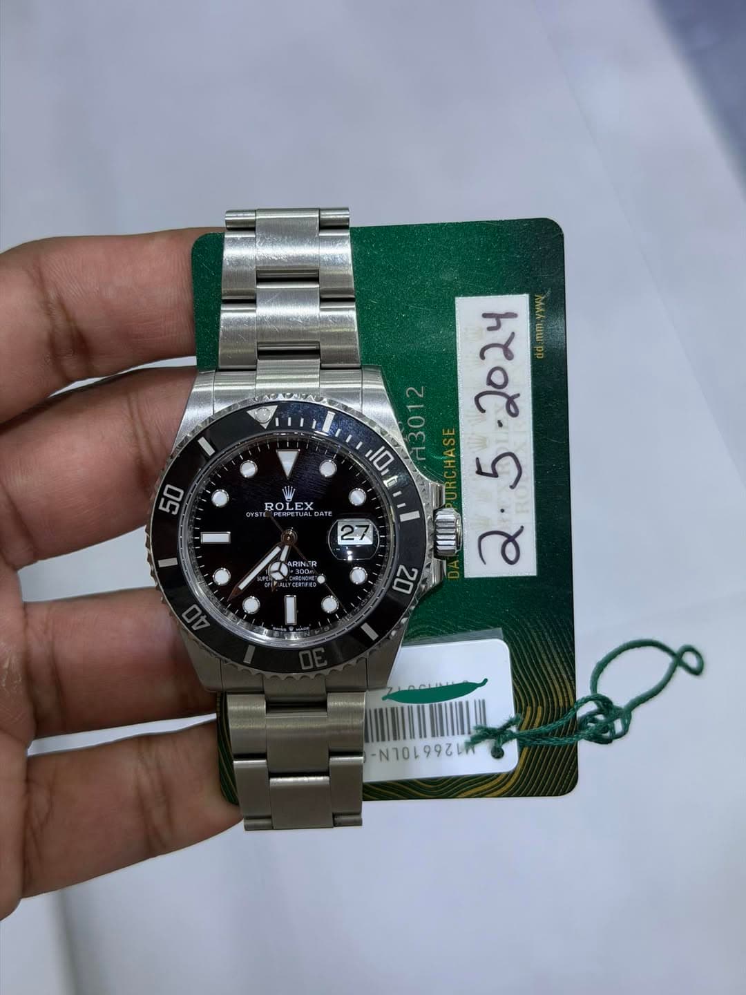 May be an image of wrist watch and text
