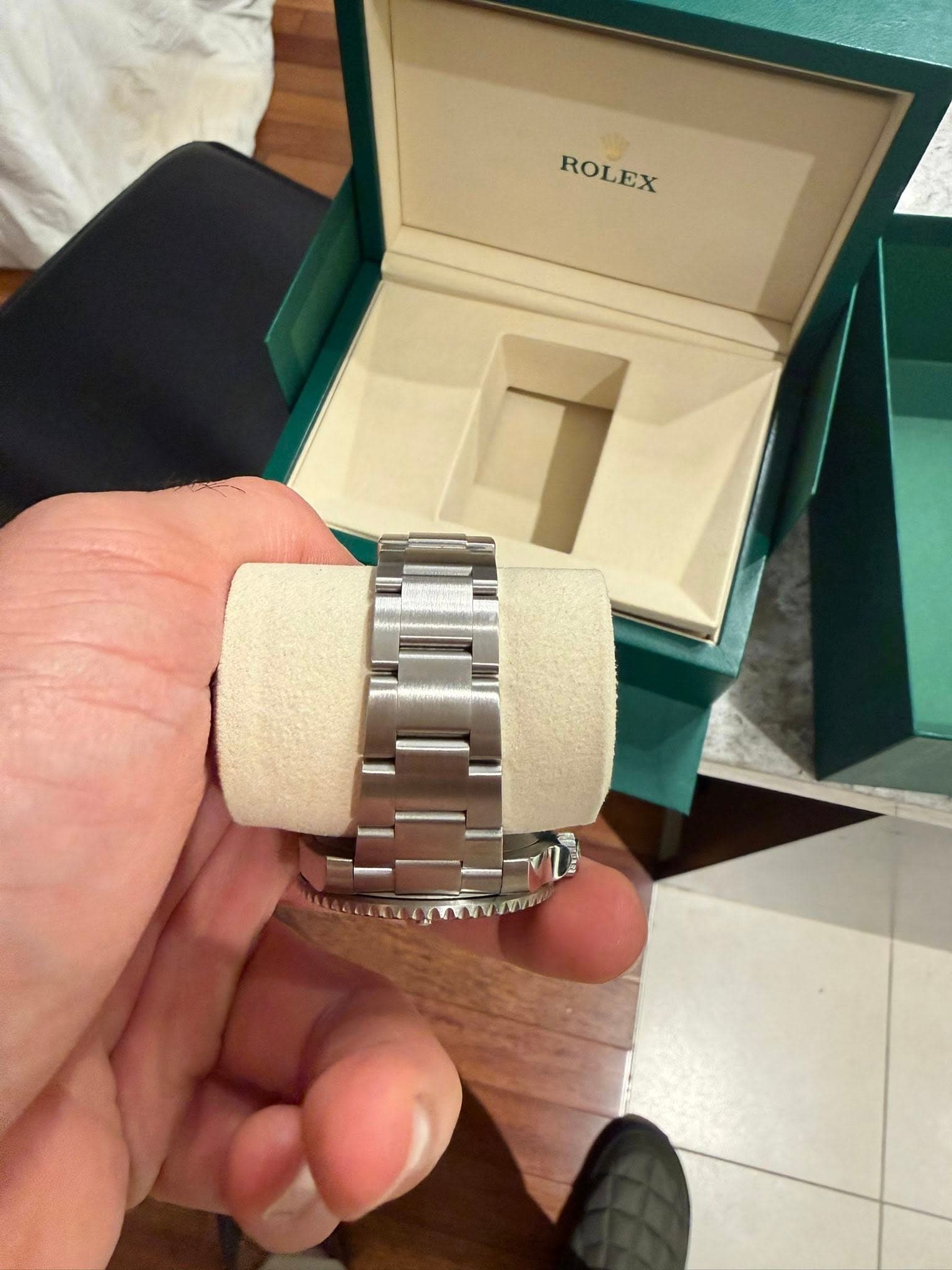 May be an image of wrist watch and text