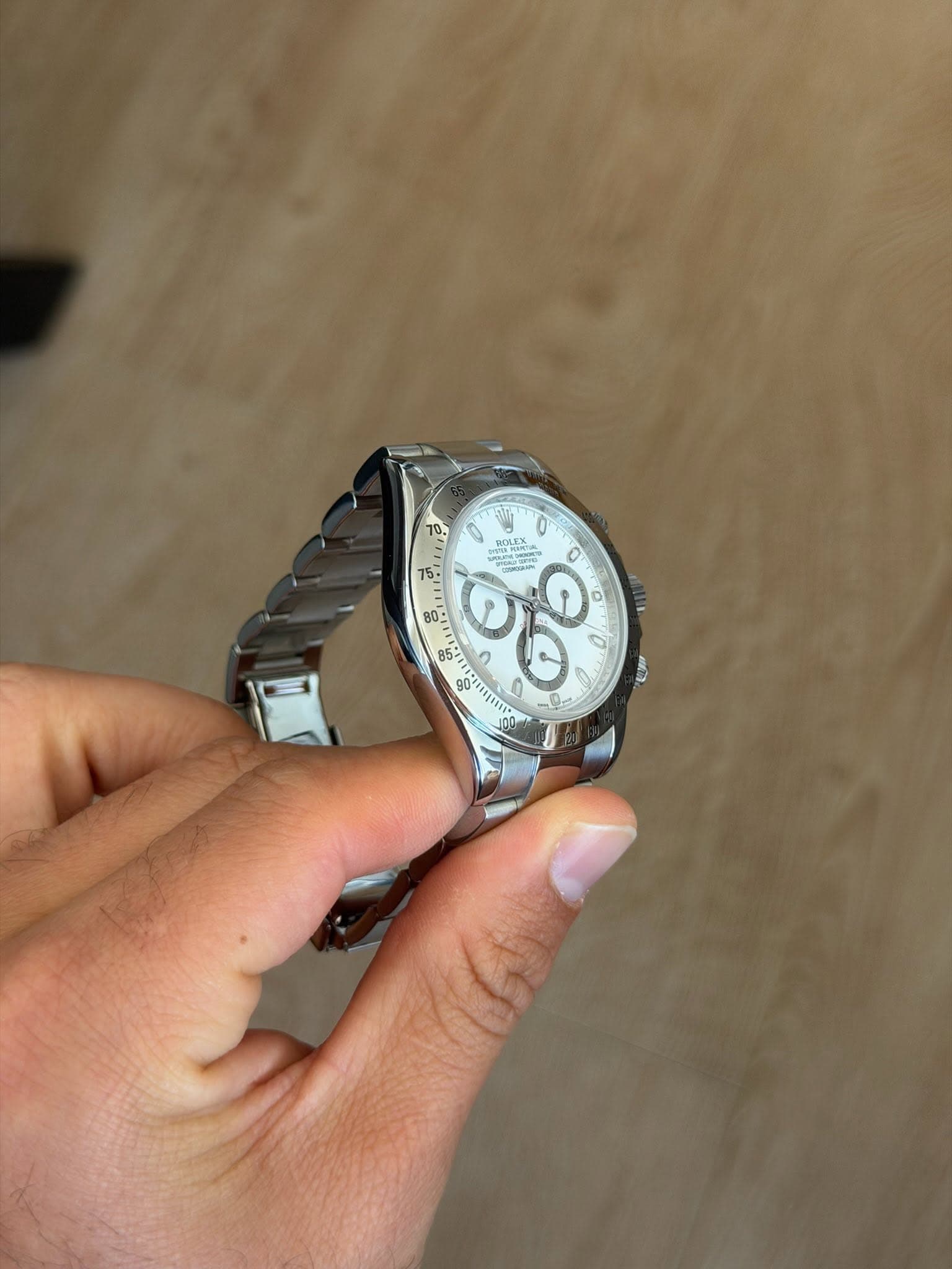 May be an image of wrist watch and text