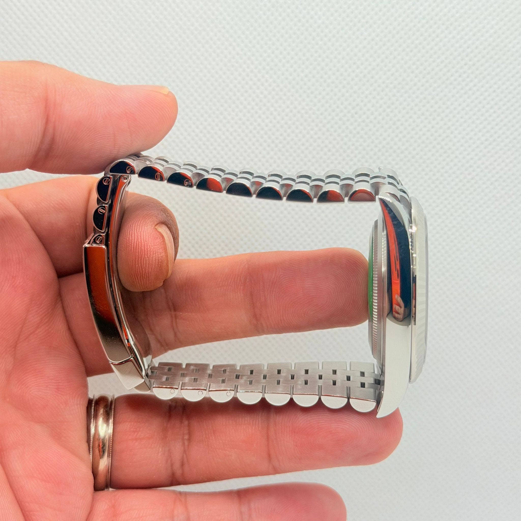 May be an image of wrist watch and jewelry