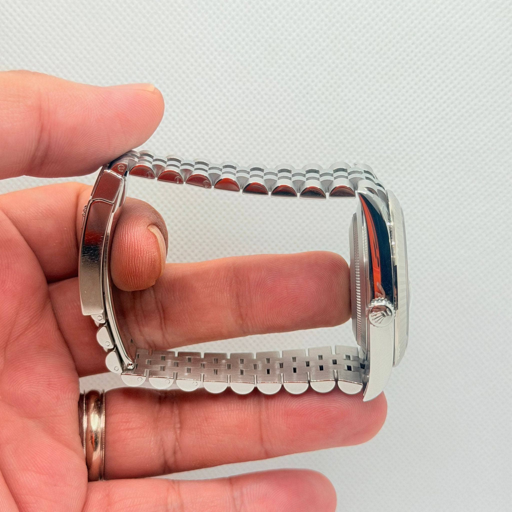 May be an image of jewelry and wrist watch