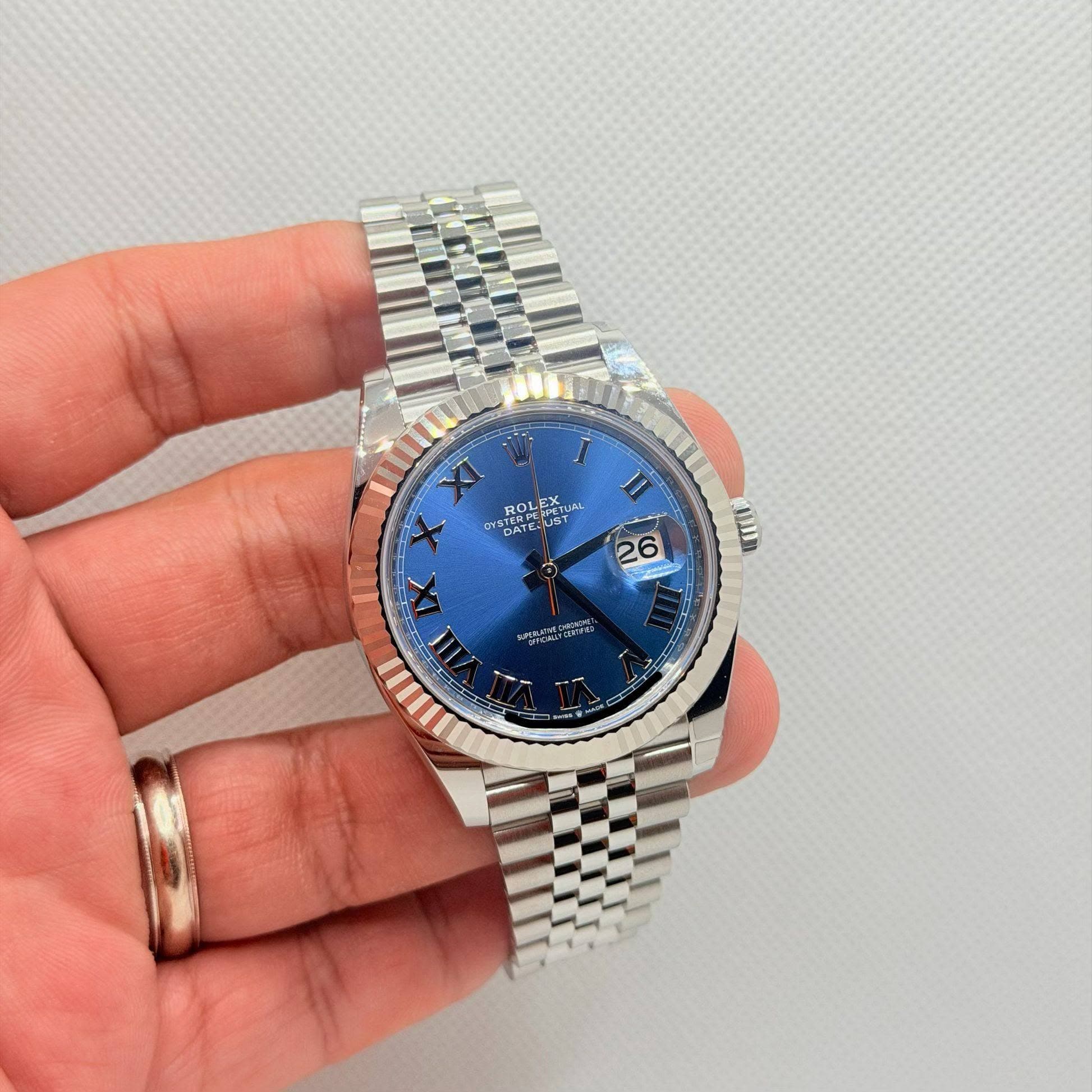 May be an image of wrist watch and text
