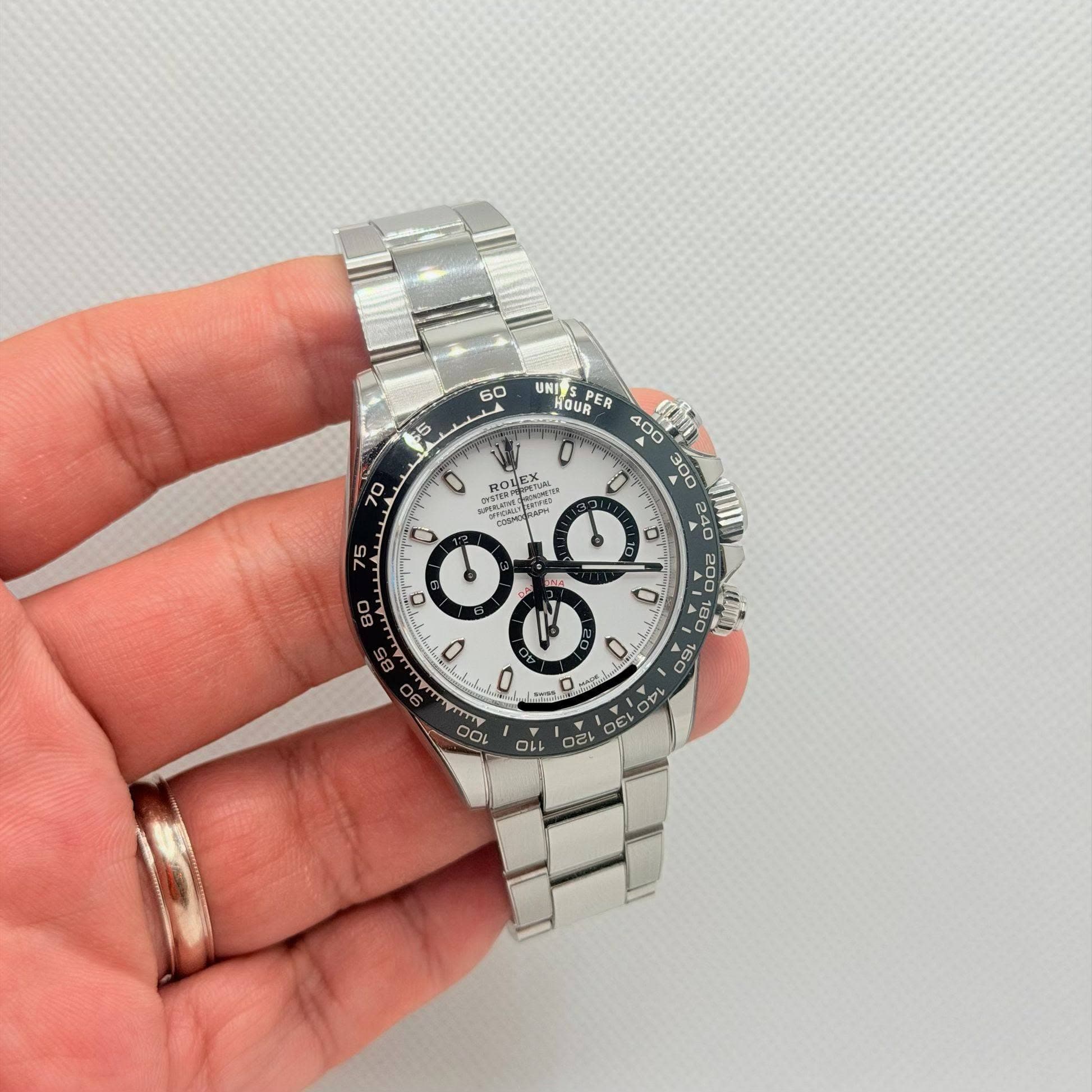 May be an image of wrist watch and text