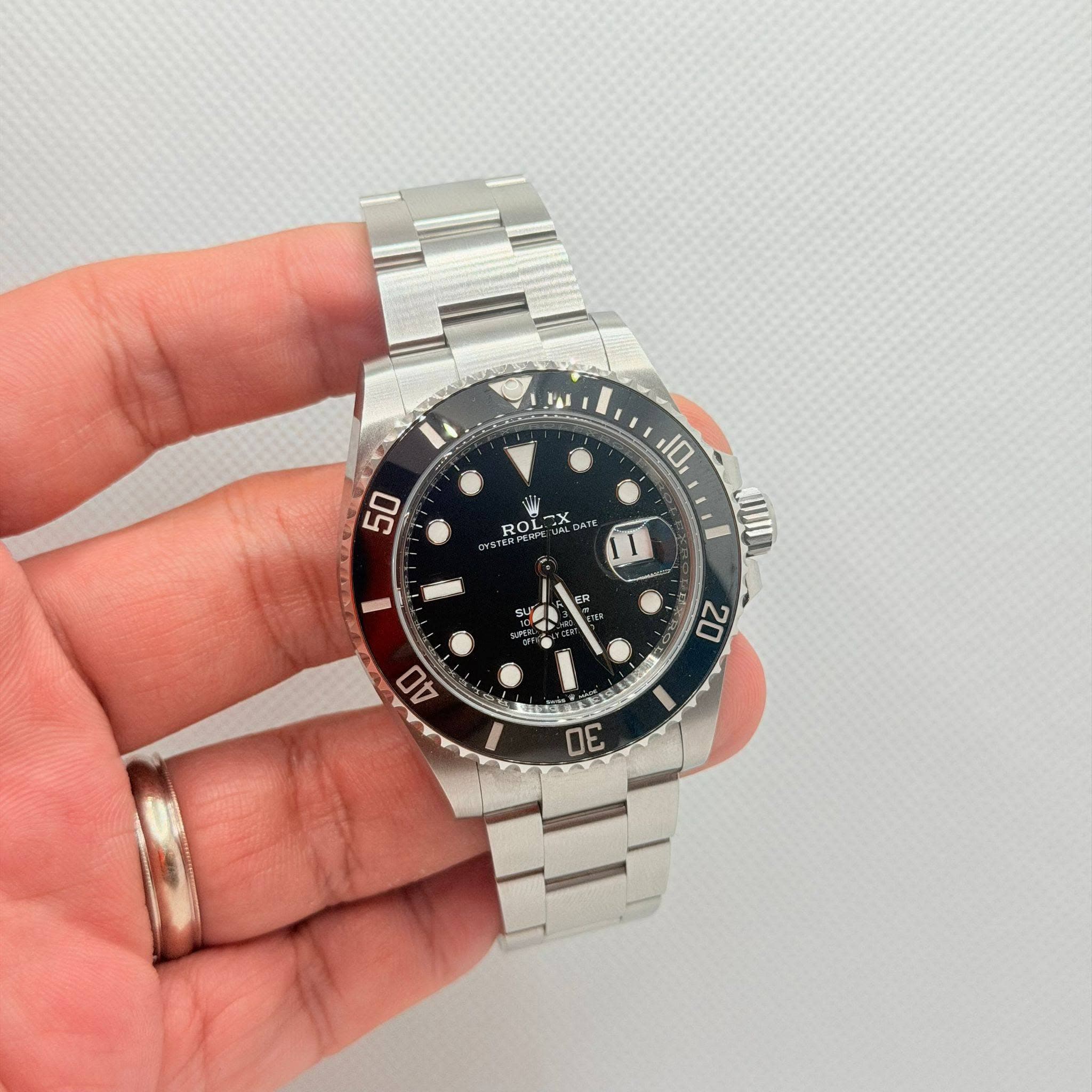May be an image of wrist watch and text