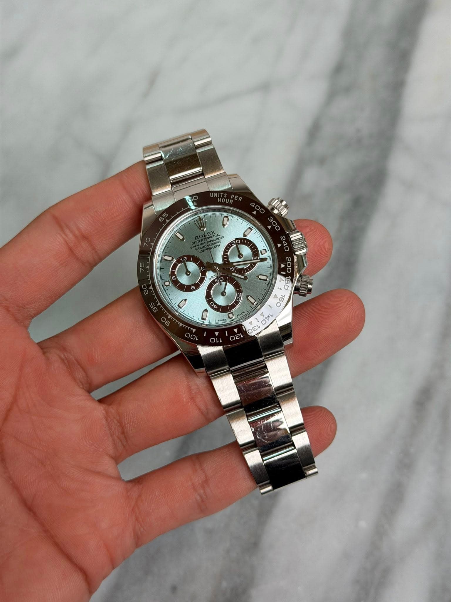 May be an image of wrist watch and text