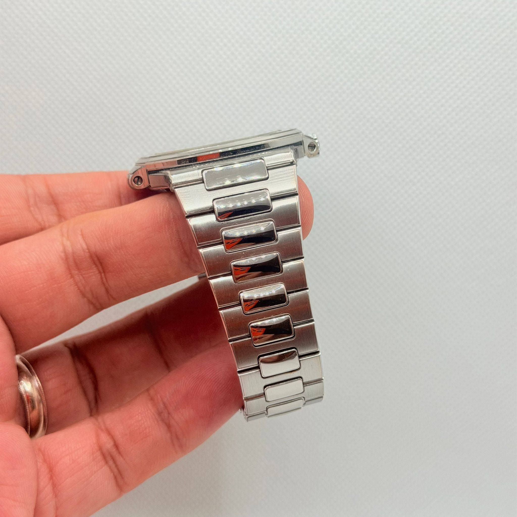 May be an image of wrist watch