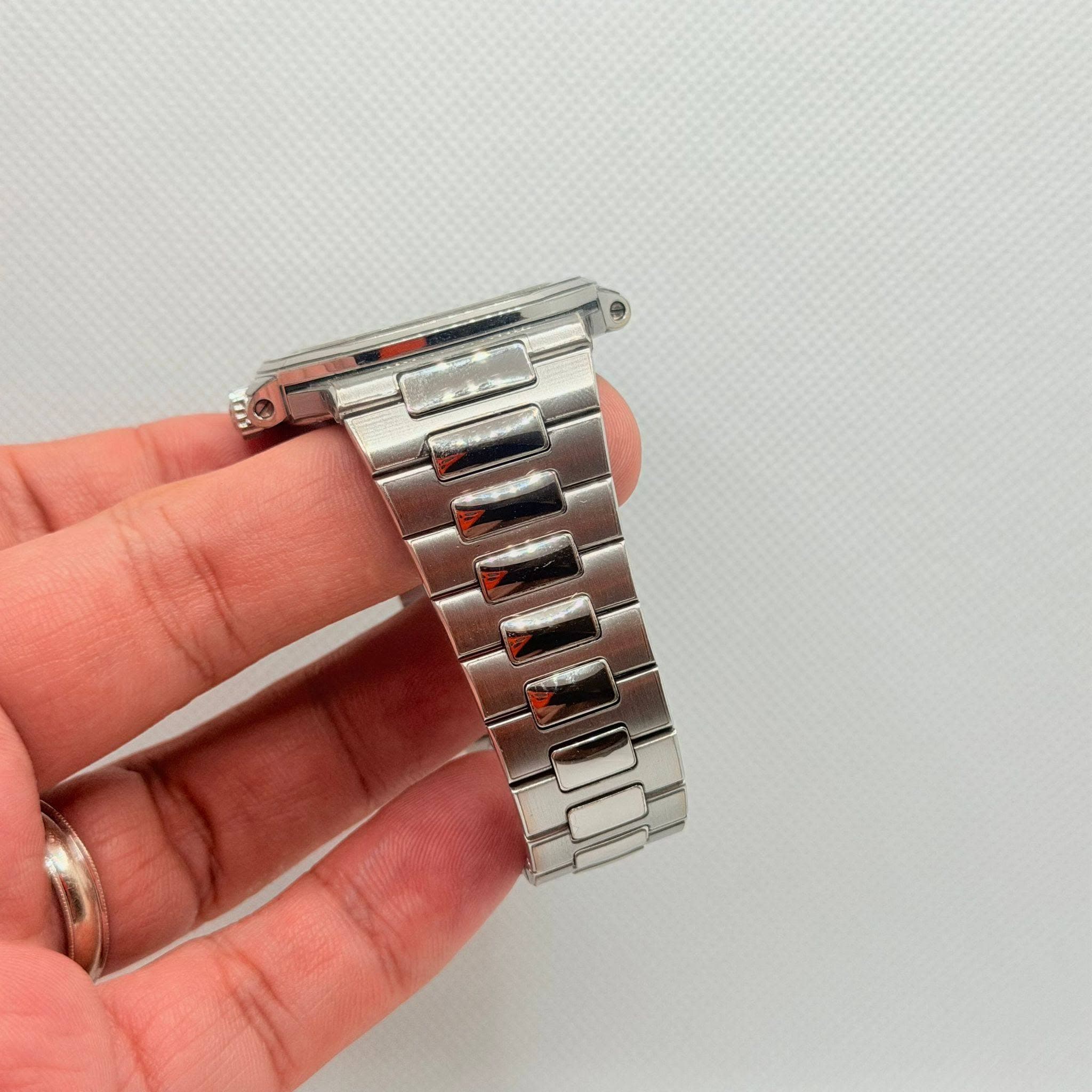 May be an image of digital watch and text