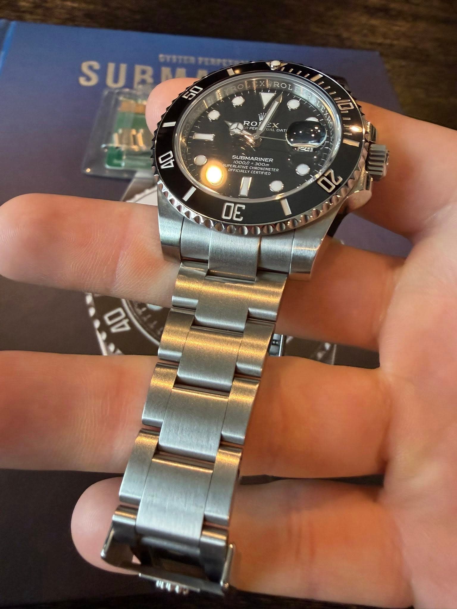 May be an image of wrist watch and text