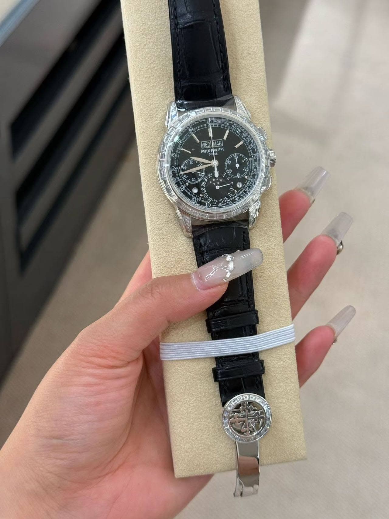 May be an image of wrist watch and text