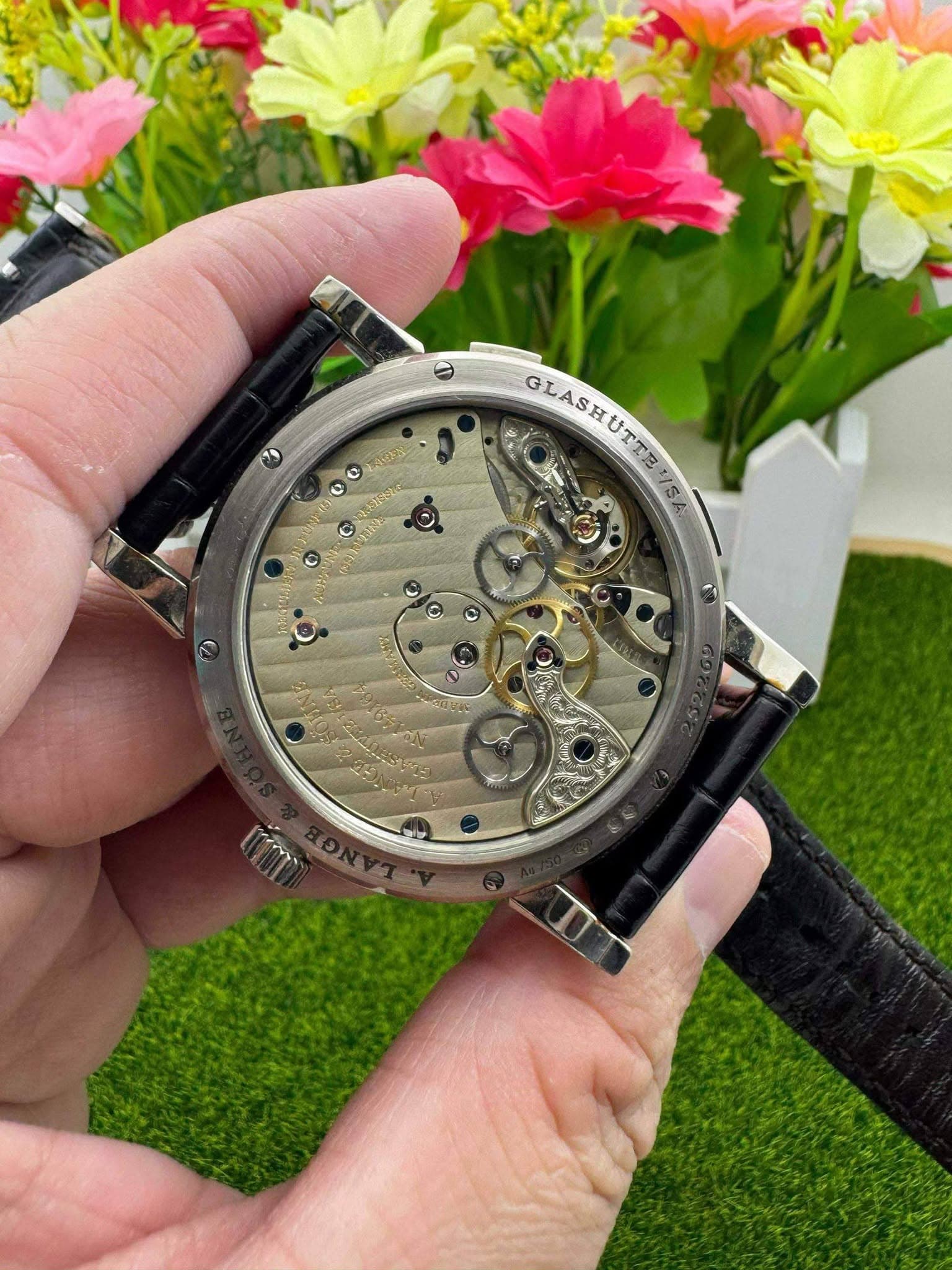 May be an image of wrist watch and text