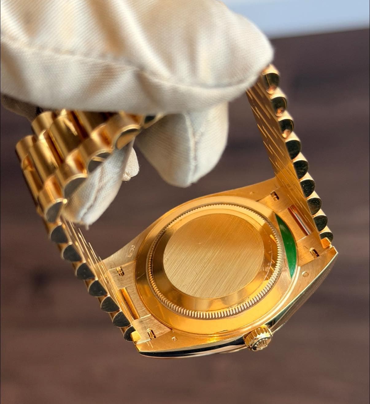 May be an image of wrist watch and text