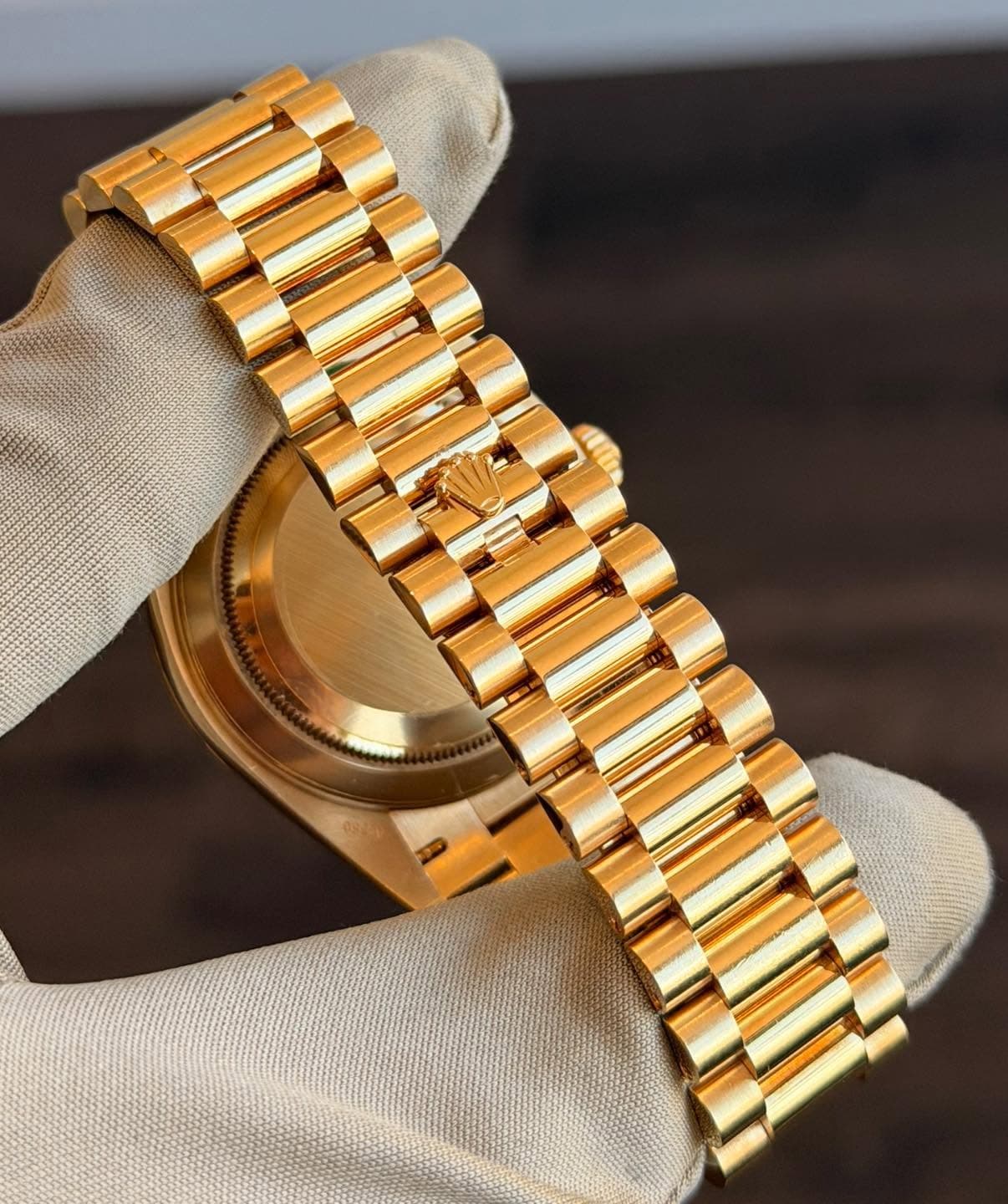 May be an image of jewelry, wrist watch and text