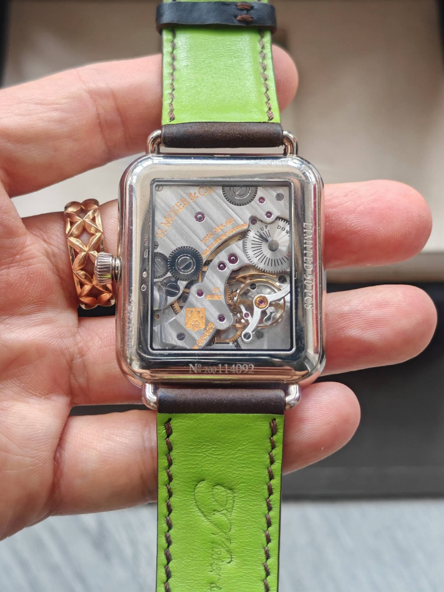 May be an image of wrist watch and text