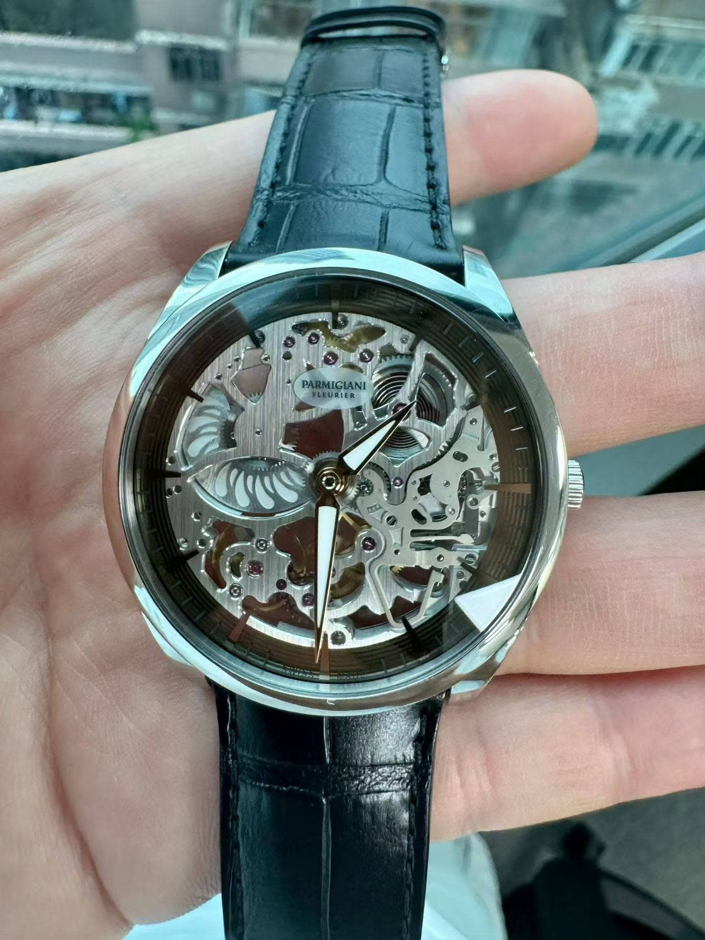 May be an image of wrist watch and text