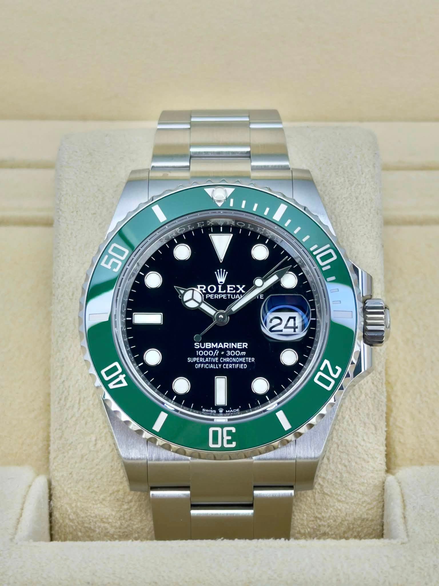 May be an image of wrist watch and text that says '50 2 ROLEX EX ROI PERPETUAL PERPE TUAI 10 E 24 SUBMARINER 1000ft まm 300m SUPERLATIVE CUDESLATIE AIE HRONGNE HRONOMETE HRGNONETE…