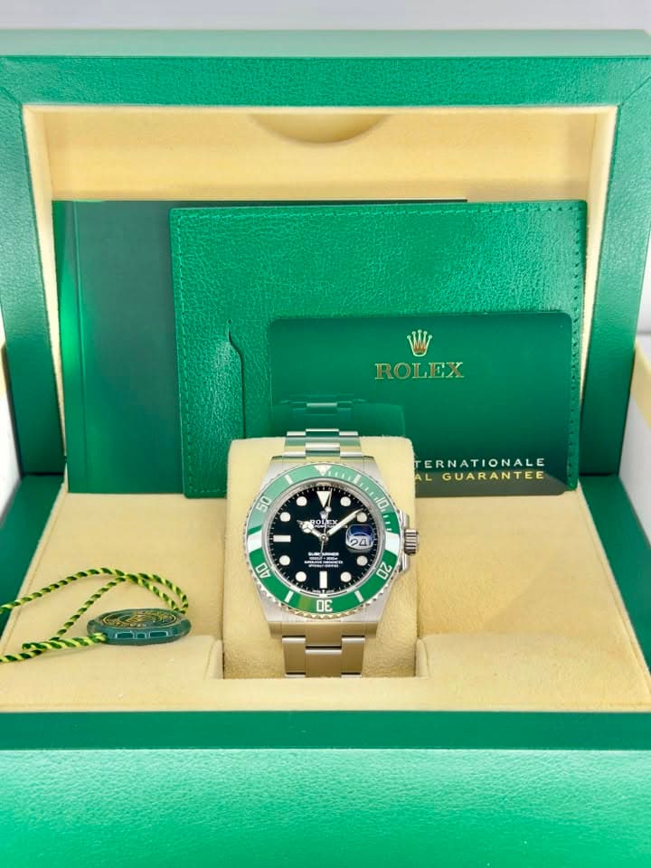 May be an image of wrist watch and text that says 'ROLEX JLEE 50 TERNATIONALE AL GUARANTEE 10 ከዋ BOLE に OLEX y 40 24 0 นิว O 20 3'