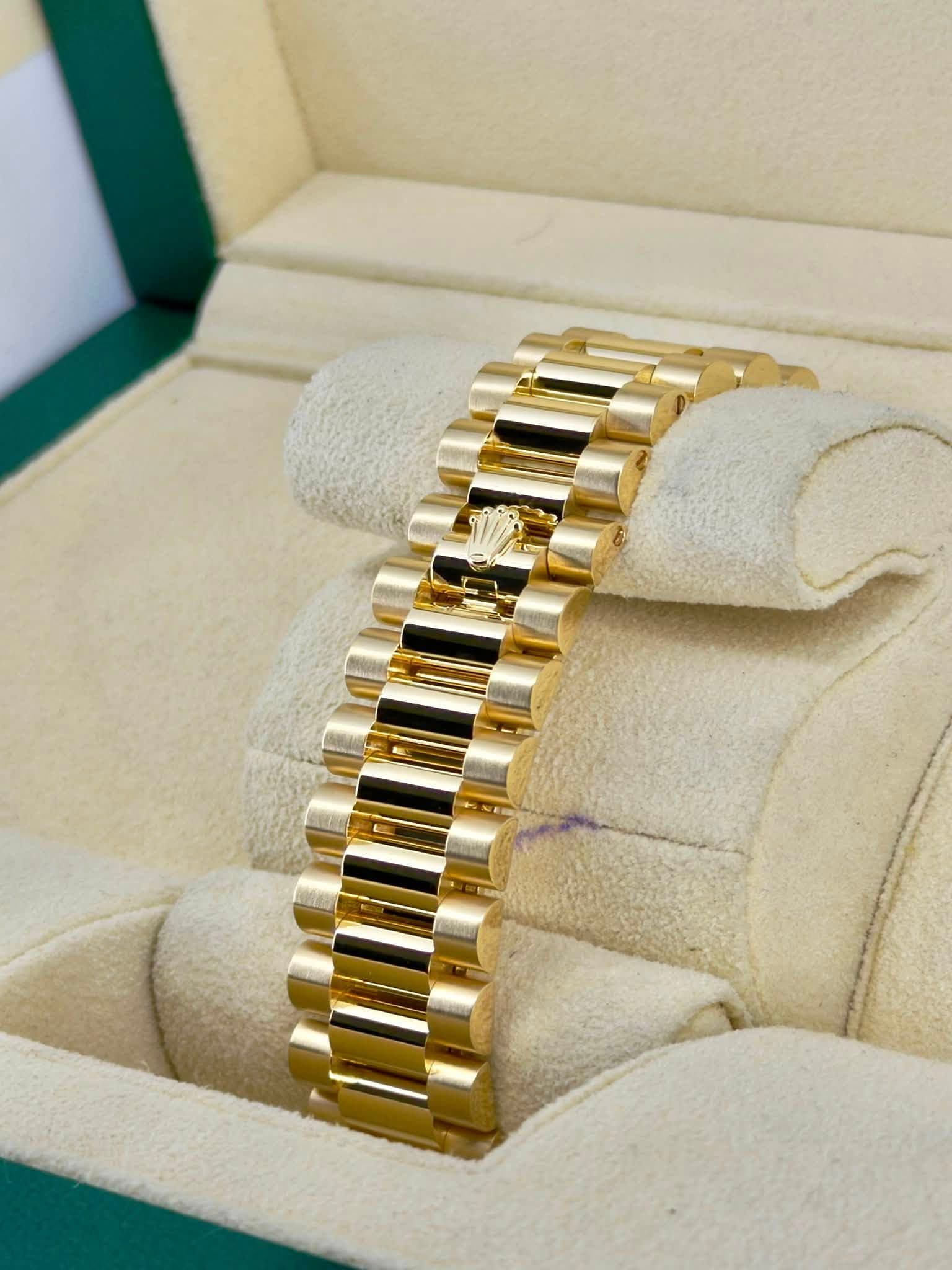 May be an image of jewelry, wrist watch and text