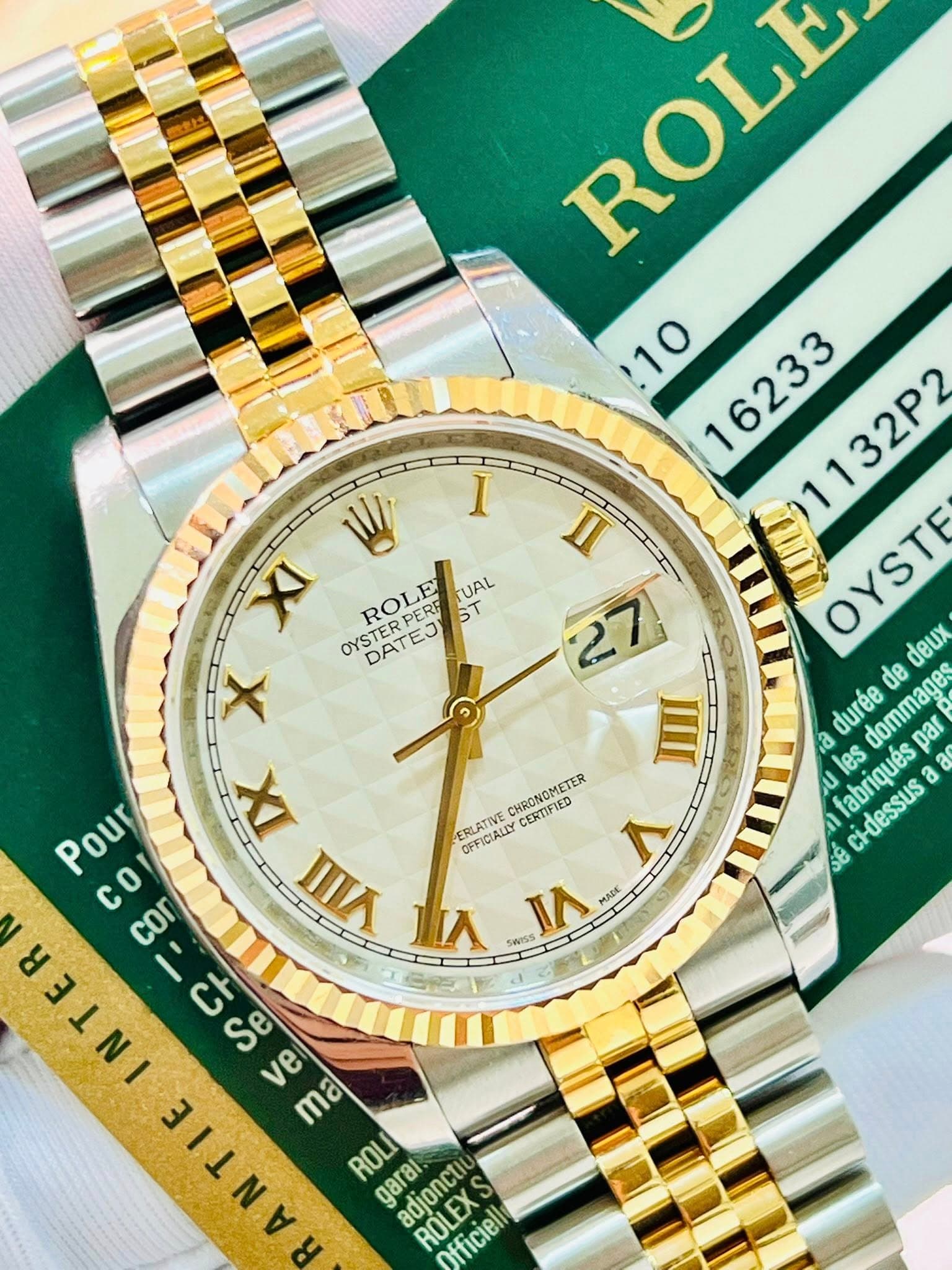 May be an image of wrist watch and text that says 'I W/ XI OYSTE OYSTERPER ROLE PERE ST UAL DATEJ) X IX VIA TIL ROLE ROLE 10 16233 1132P2 OYSTE deux de a les durée dommages par…